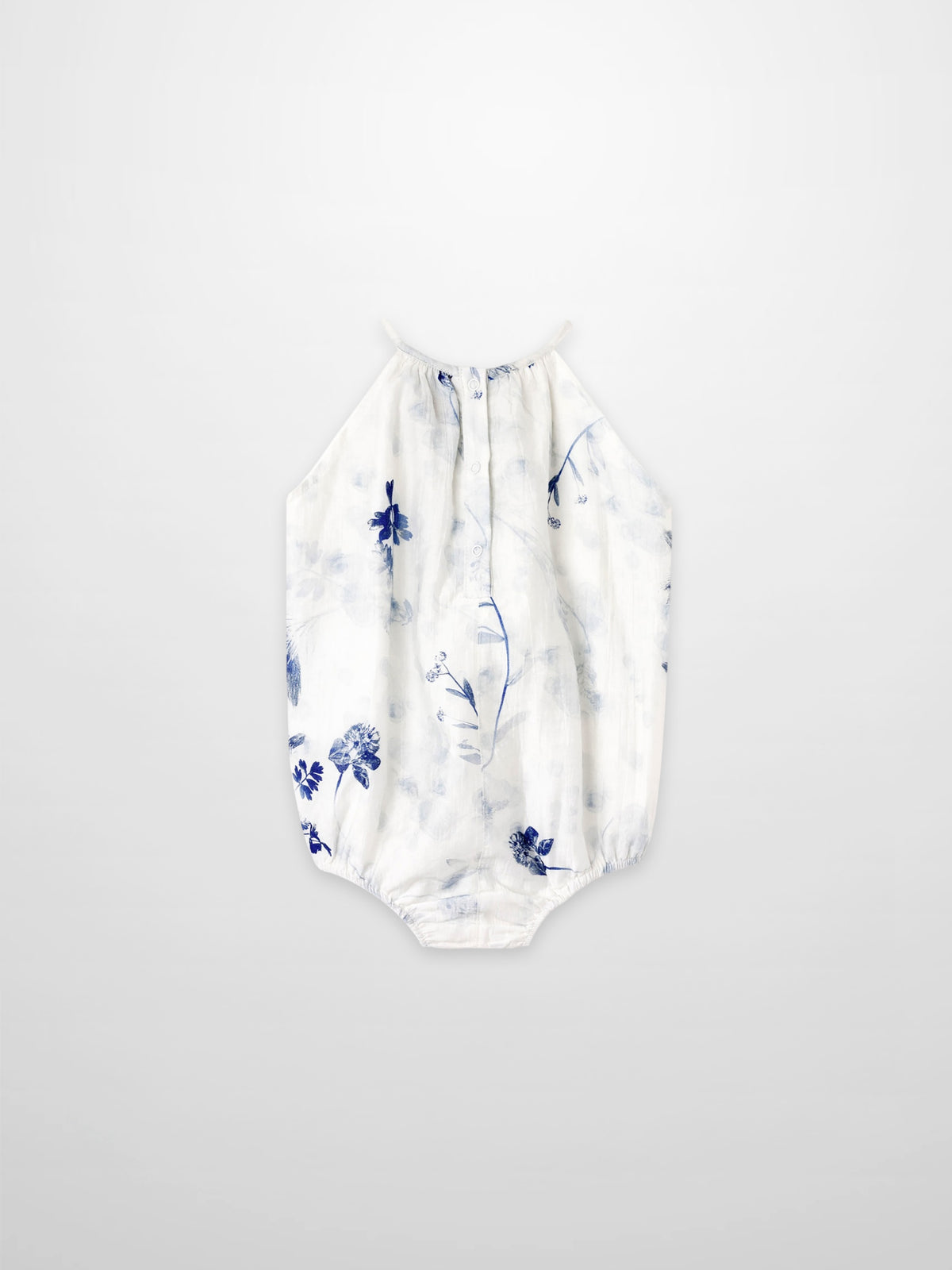 Blue Flower Romper for girls by Adee; white fabric with blue floral print, halter-neck style