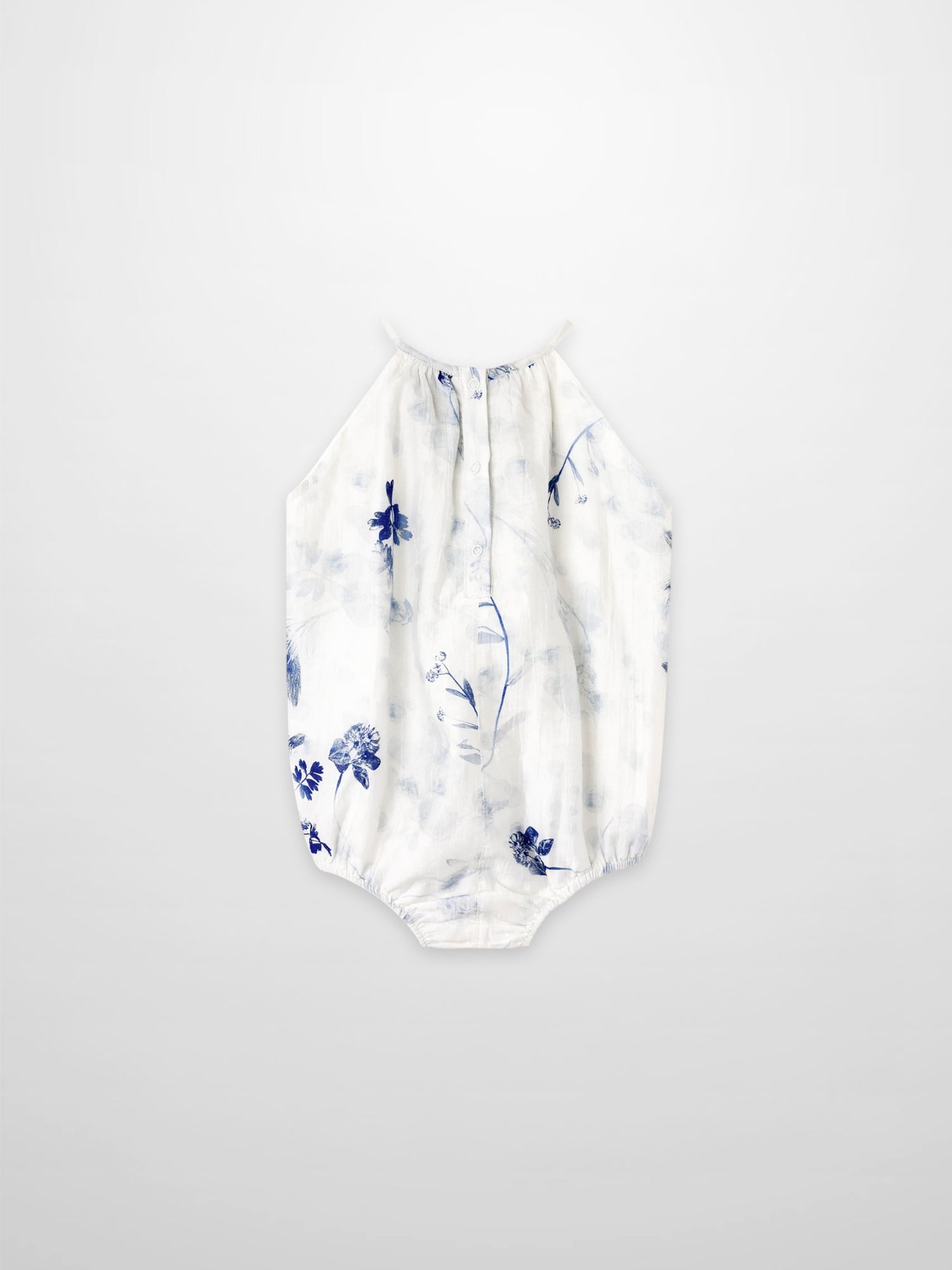 Blue Flower Romper for girls by Adee; white fabric with blue floral print, halter-neck style