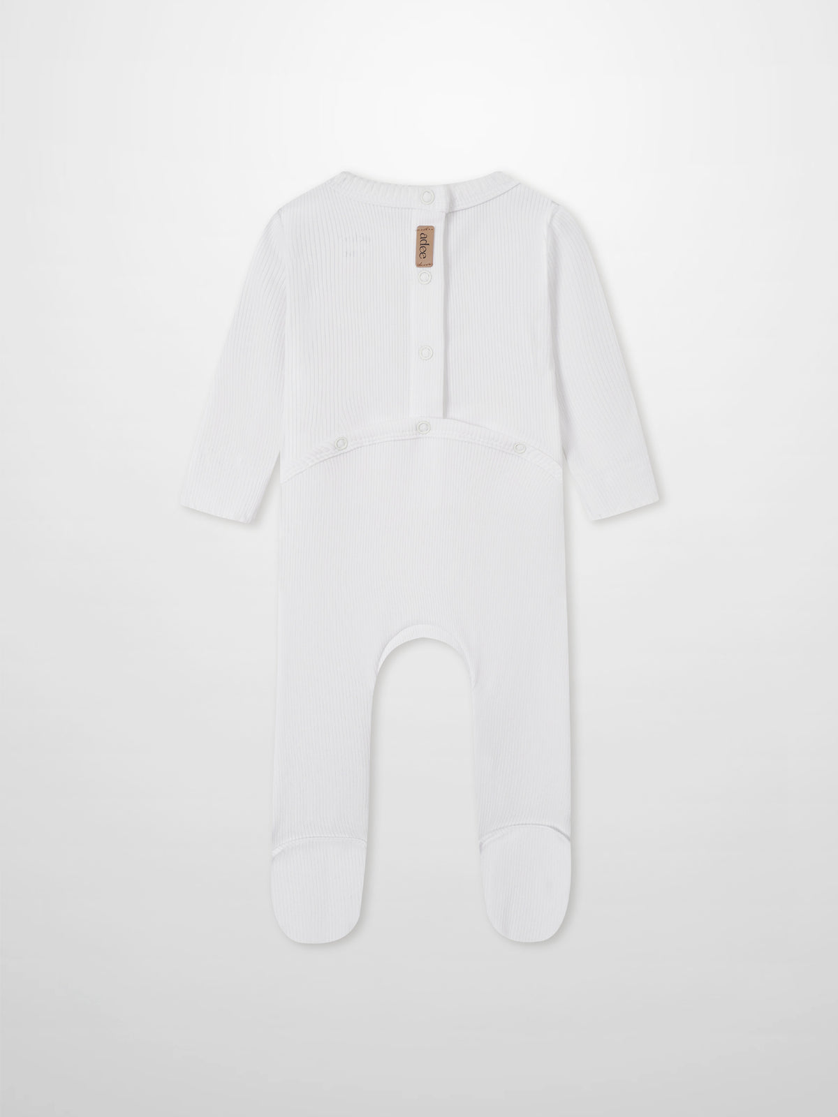 Legacy Stitch Stretchy white unisex romper by Adee with ribbed knit and back snap placket; brand tag visible.