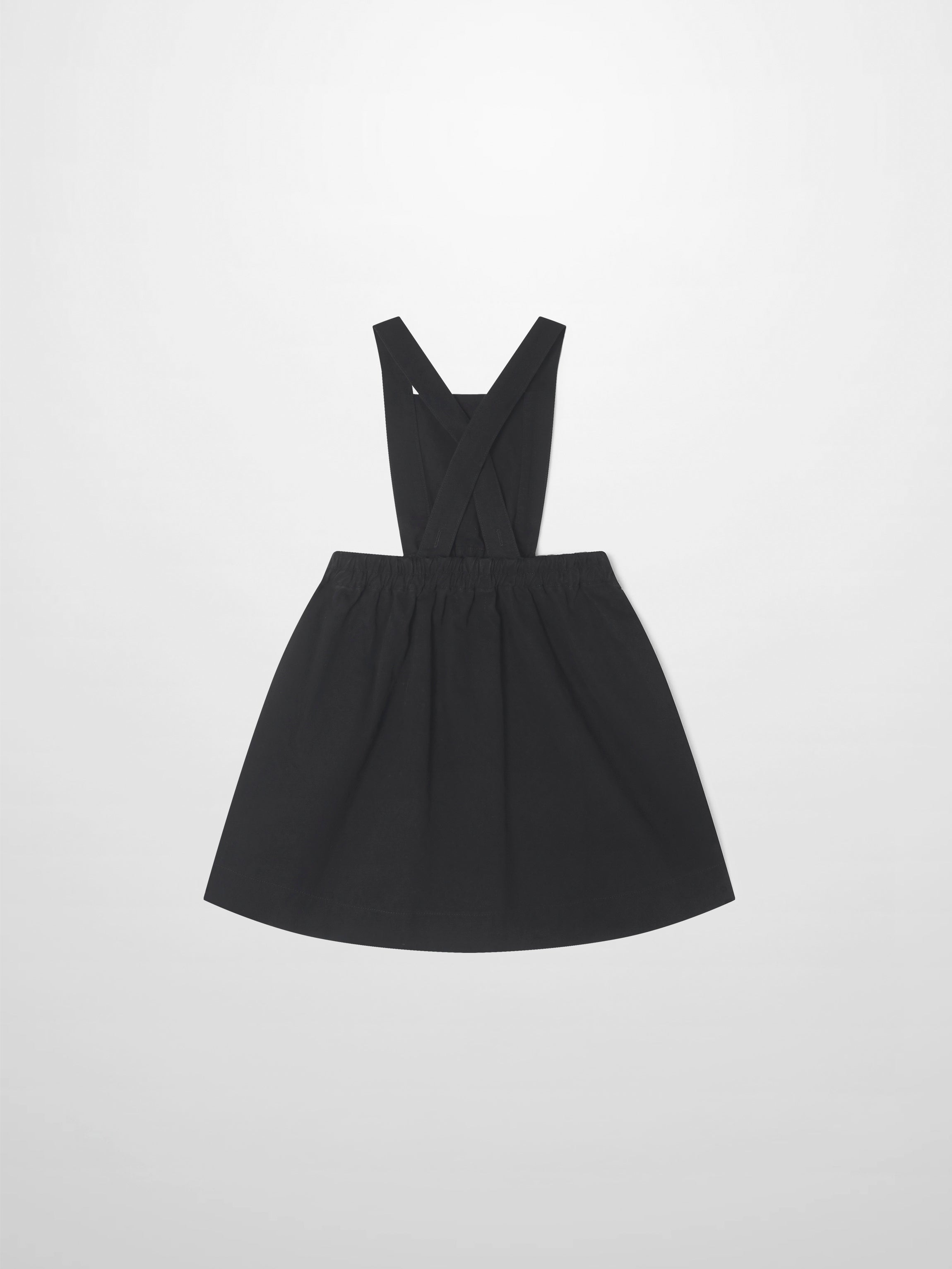 Denim jumper dress for girls in black with cross-back straps