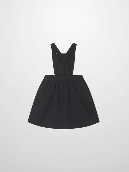 Denim jumper dress for girls in black with cross-back straps