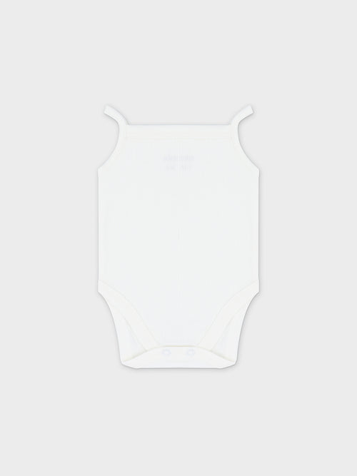 White ribbed undershirt bodysuit with thin straps and bottom snap closures; three-pack.