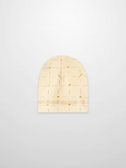 Grand Slam Hat, beige knit with pale blue grid lines and orange dots.