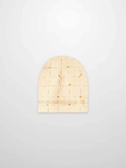 Grand Slam Hat, beige knit with pale blue grid lines and orange dots.