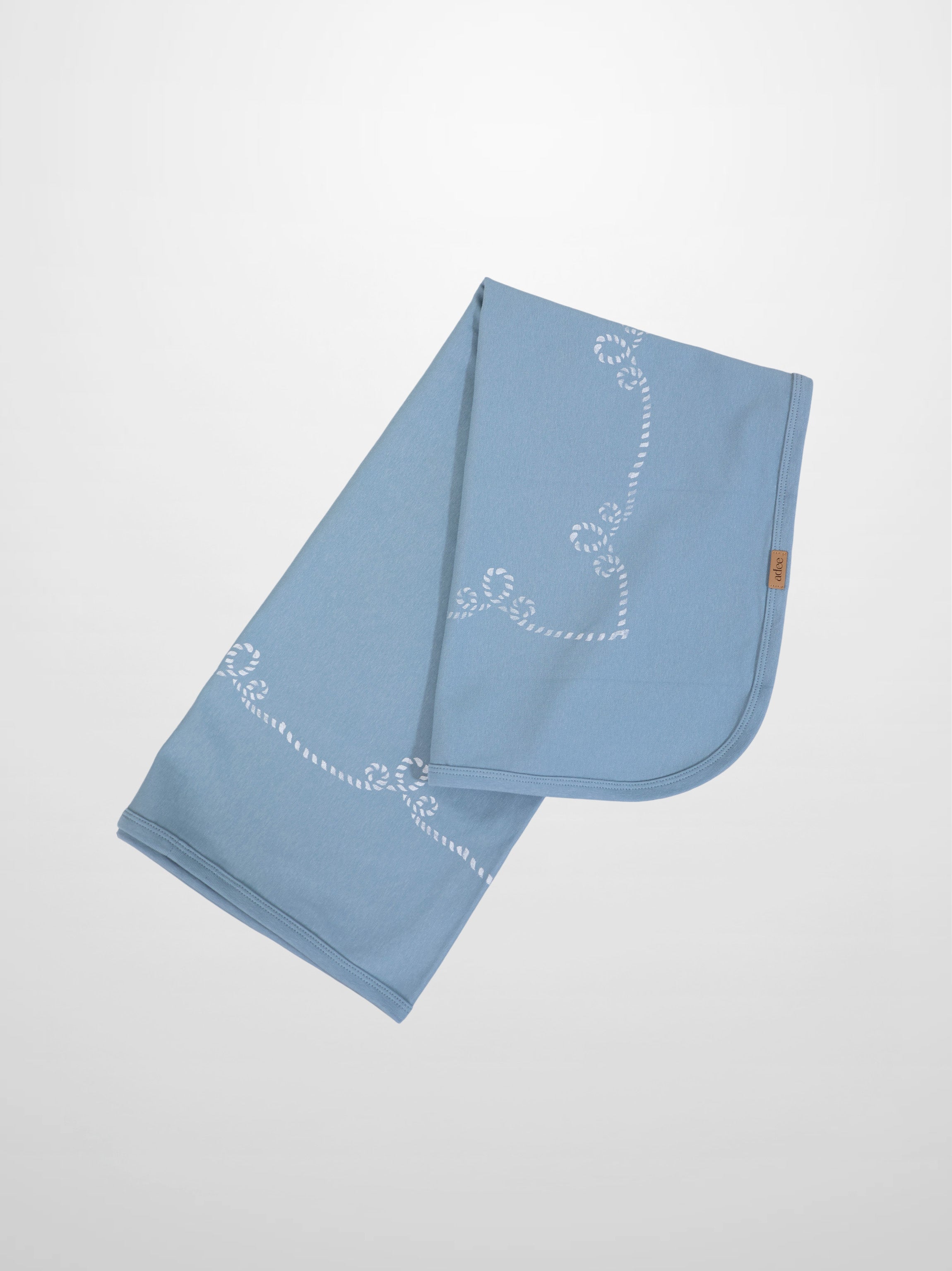 Blue Anchor Blanket by Adee, a boys swaddle blanket in light blue with a white rope motif.