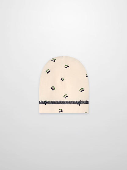 Blue Cherry Hat for boys with beige background and green leafy cherry print