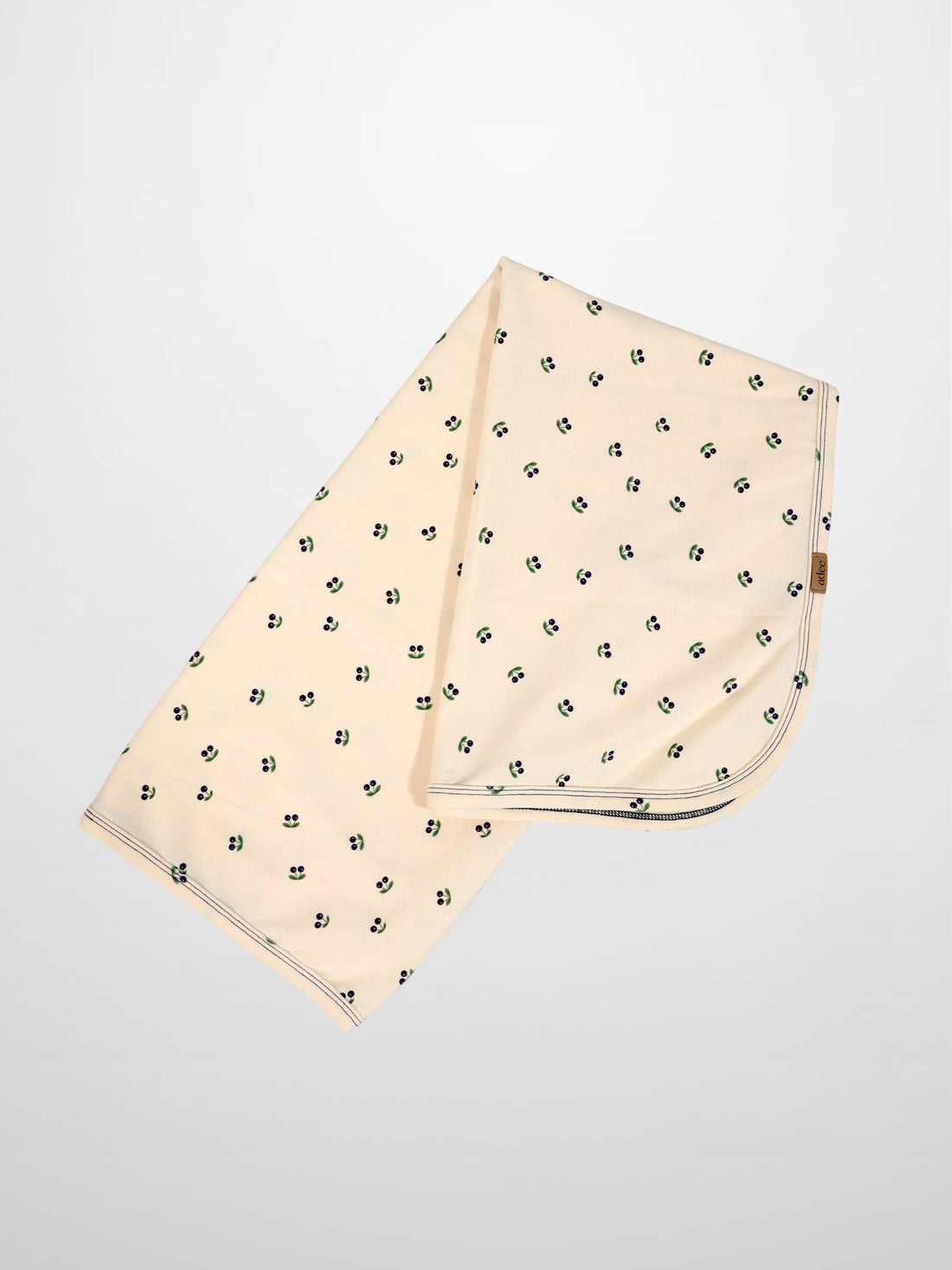 Blue Cherry Blanket swaddle for boys by Adee; cream fabric with scattered blue cherries
