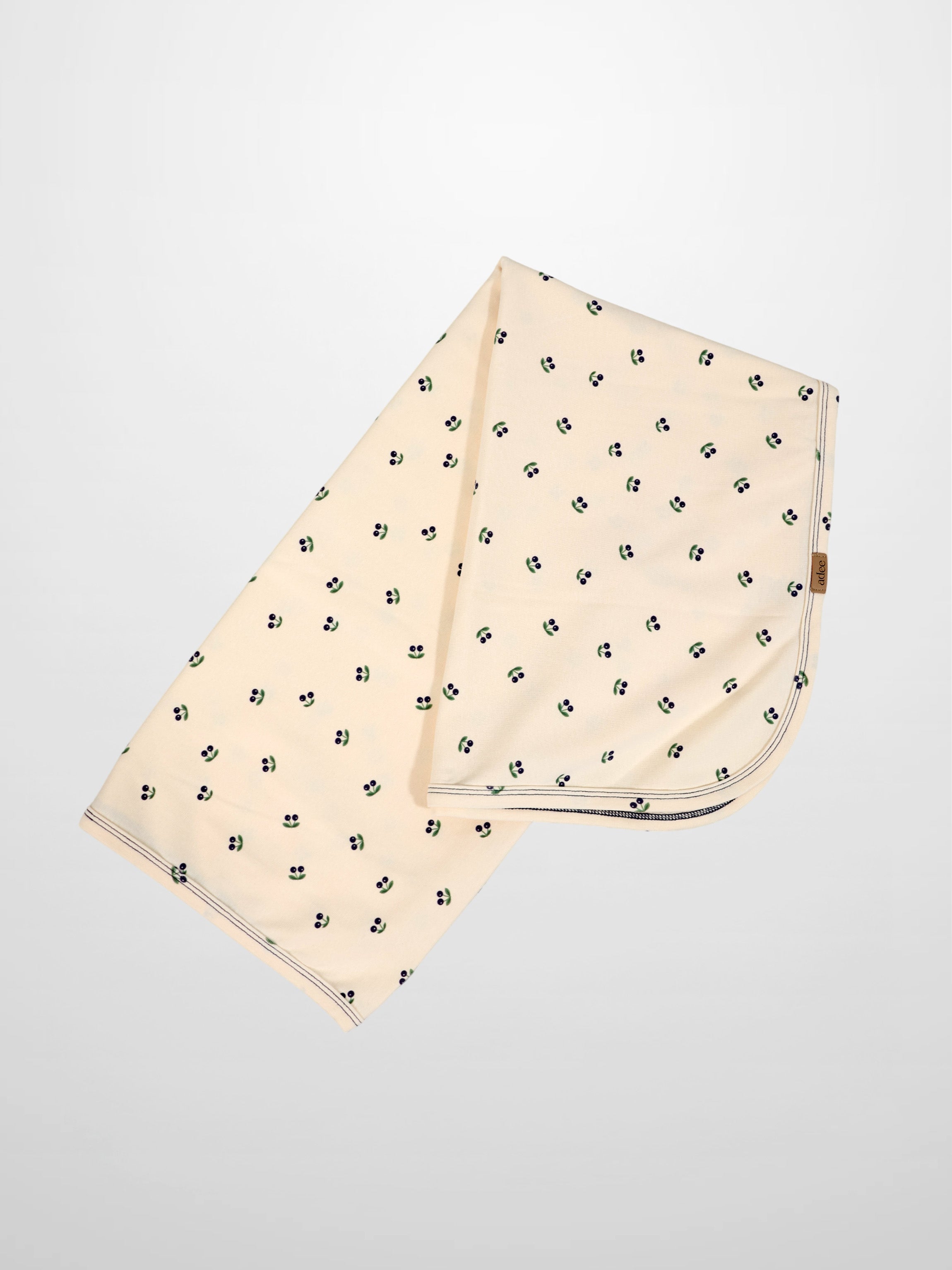 Blue Cherry Blanket swaddle for boys by Adee; cream fabric with scattered blue cherries
