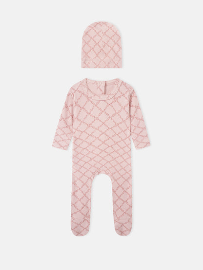 Adee Pink Leaf two-piece layette set for girls; knit hat and footed romper in pink lattice pattern.