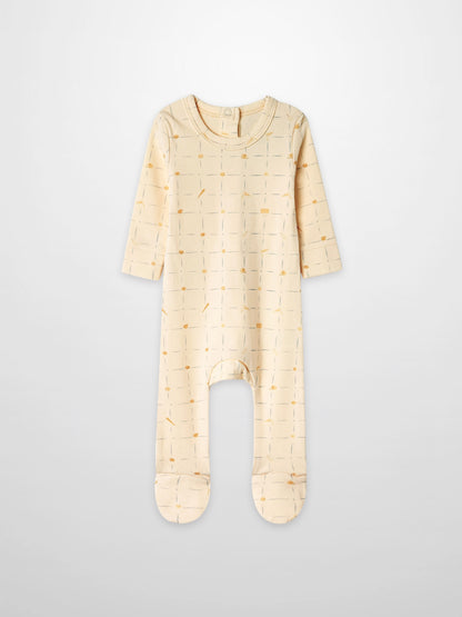 Grand Slam Stretchy Boys Stretchies romper in cream with thin pale blue strokes and orange dots.