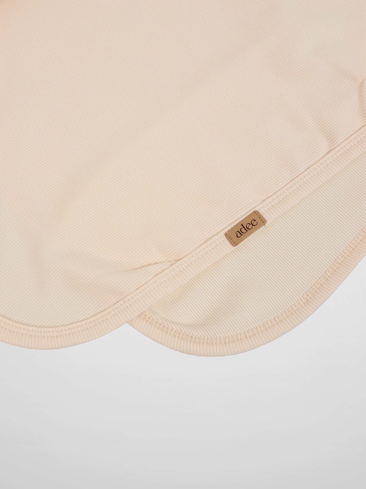Thin ribbed blanket in cream by Adee, unisex blanket.