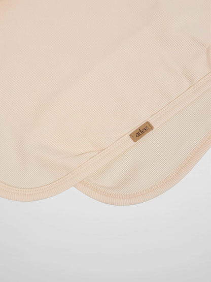 Thin ribbed blanket in cream by Adee, unisex blanket.