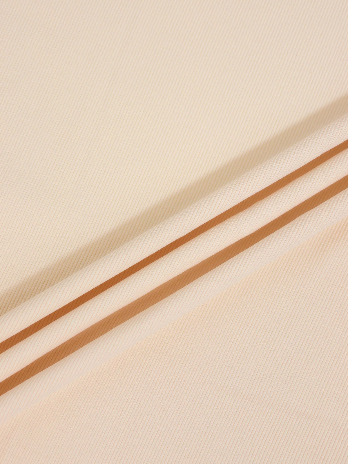 Thin ribbed tan beanie by Adee; unisex apparel accessory