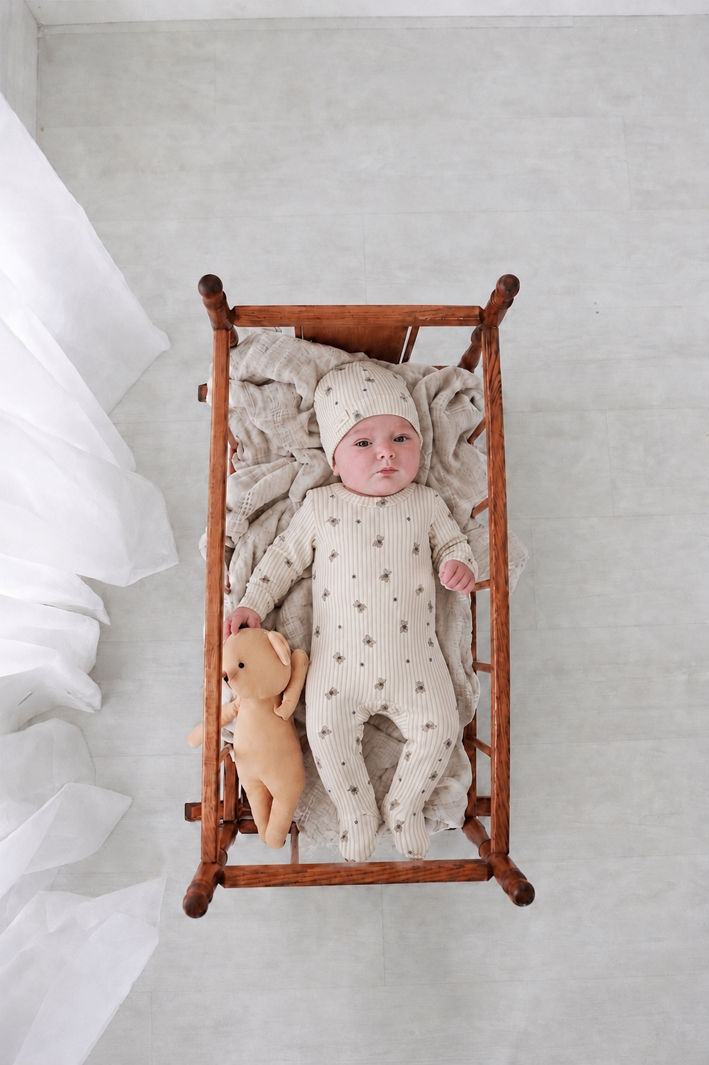 Striped Bear Stretchy - Blue baby outfit; cream striped fabric with bear prints, baby and plush teddy in cradle