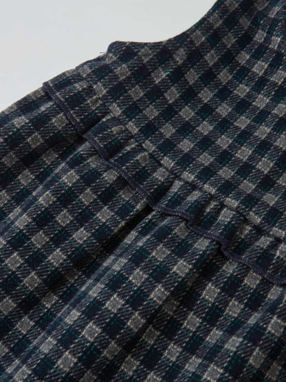 Plaid overalls with ruffles for girls in navy by Adee; dressy style, texture-rich plaid fabric detail.