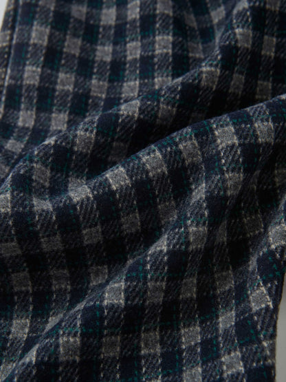 Plaid Overalls with Ruffles by Adee; navy plaid fabric close-up with gray and teal checks