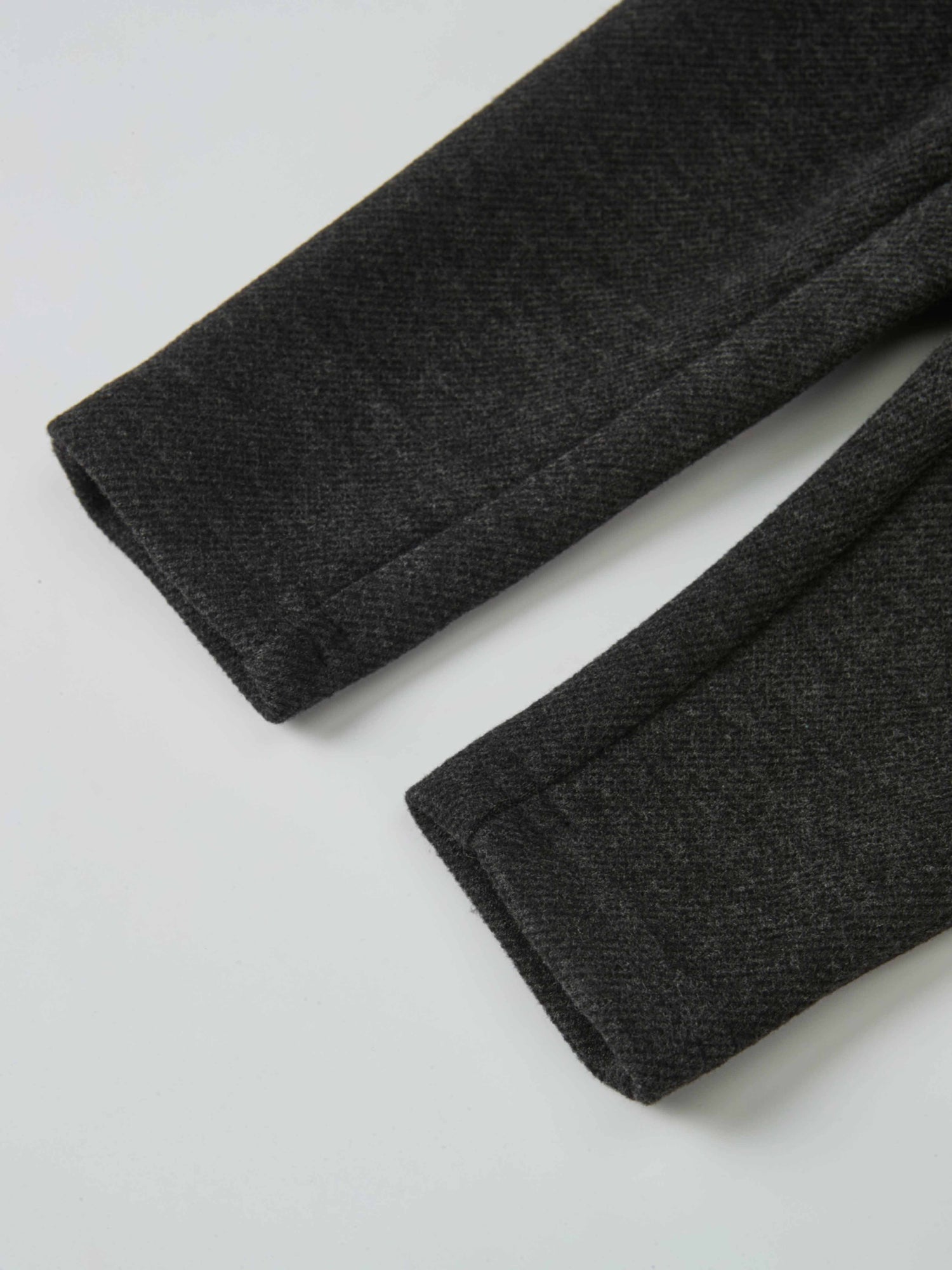 Textured grey twill overalls fabric, boys dressy style, close-up of cuffs