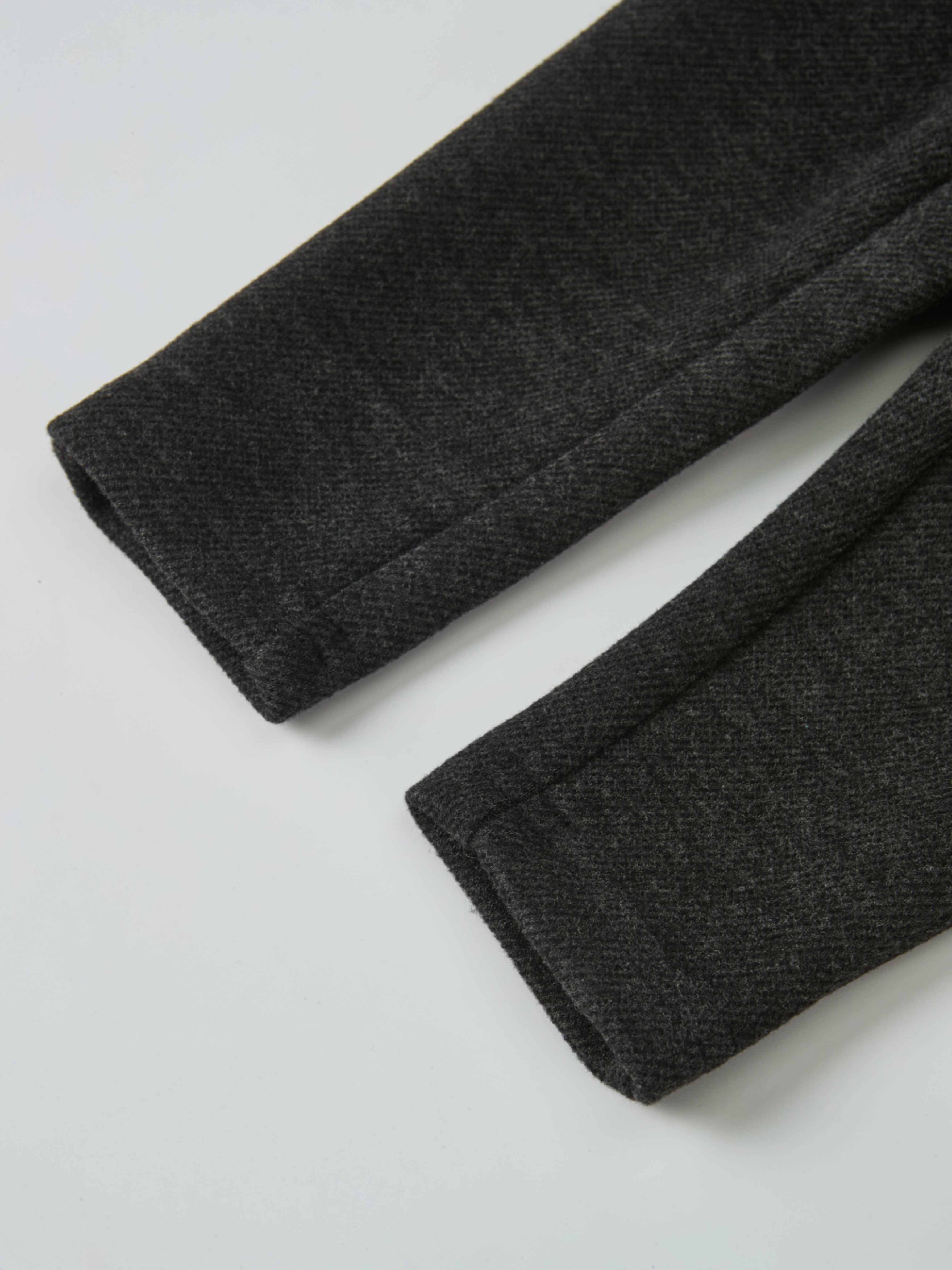 Textured grey twill overalls fabric, boys dressy style, close-up of cuffs