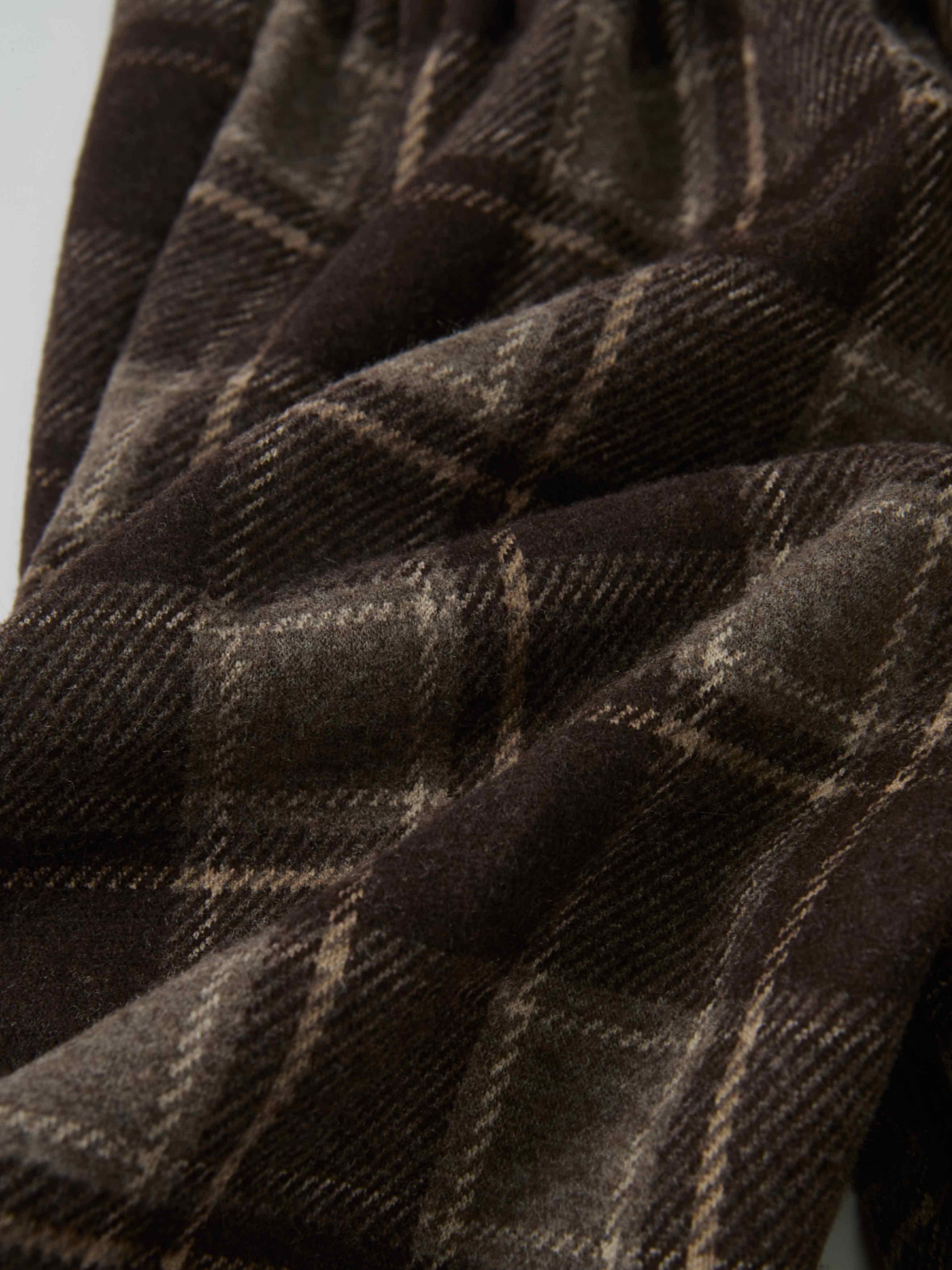 Plaid Overalls - Brown fabric close-up with a soft, textured weave