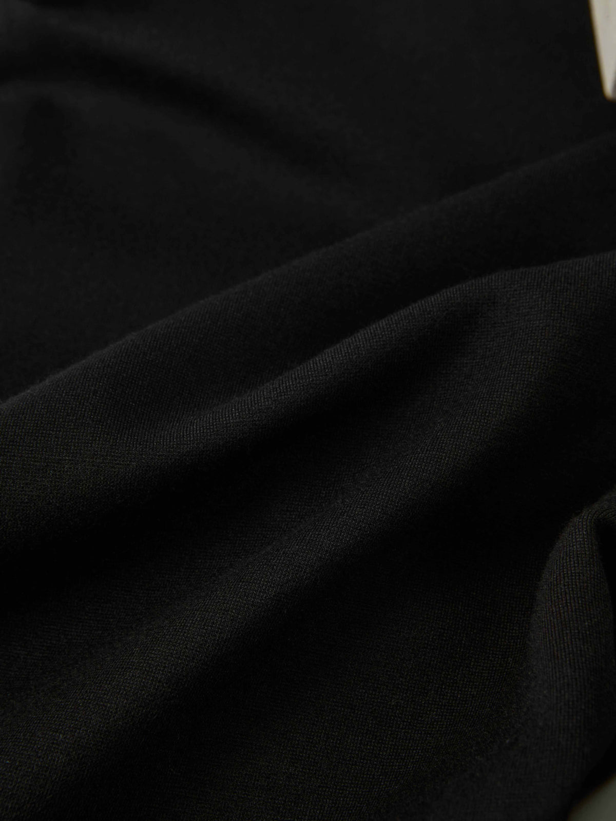 Dress pants black fabric close-up showing smooth textile texture