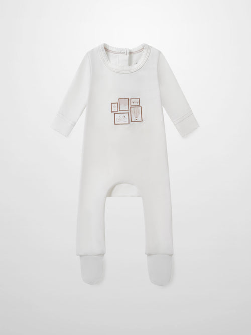 Mini Gallery Stretchy Pink girls sleeper by Adee; white footed onesie with pink framed art on chest.