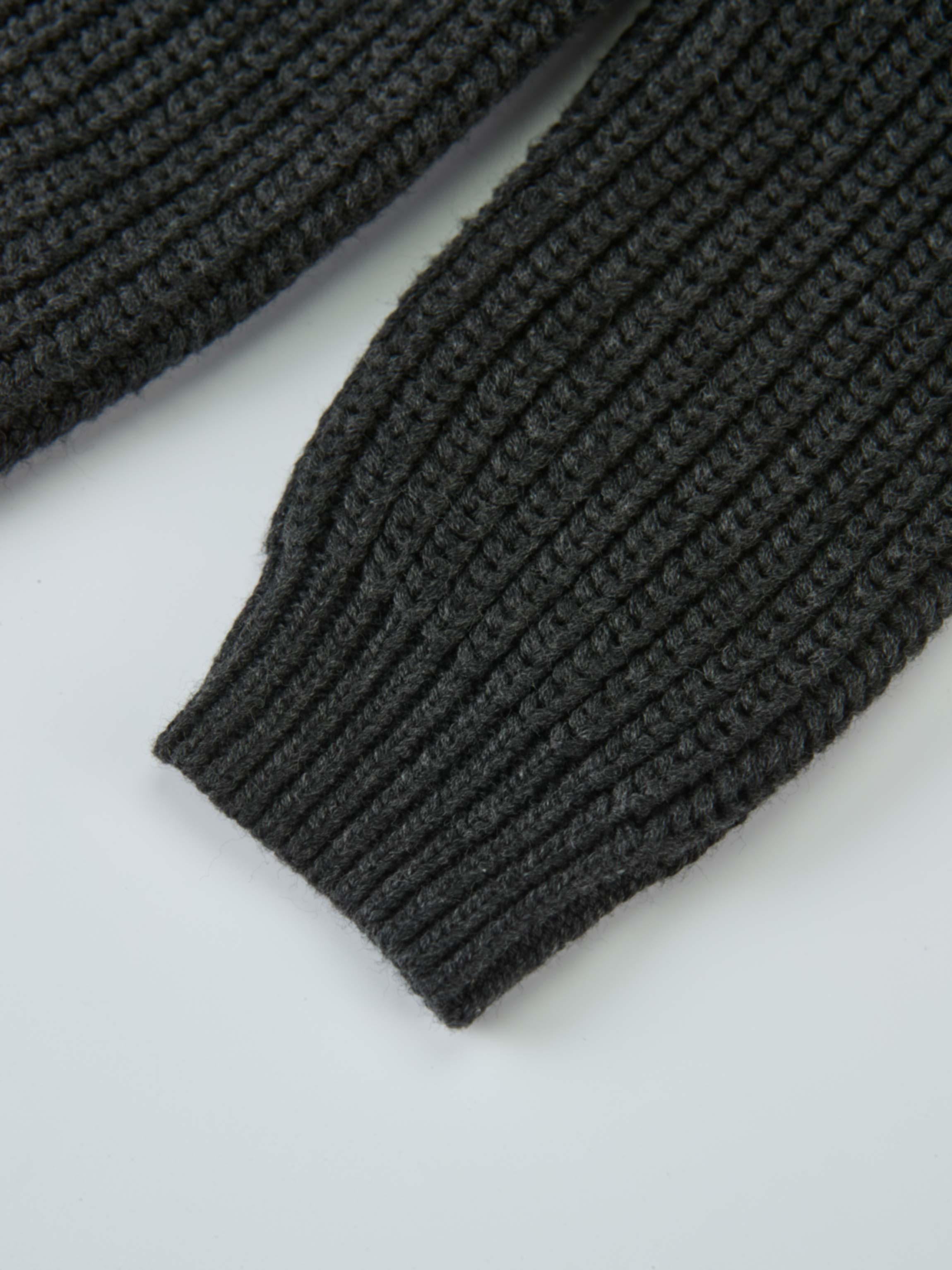 Knit Girl Sweater grey ribbed knit cuffs close-up fabric texture