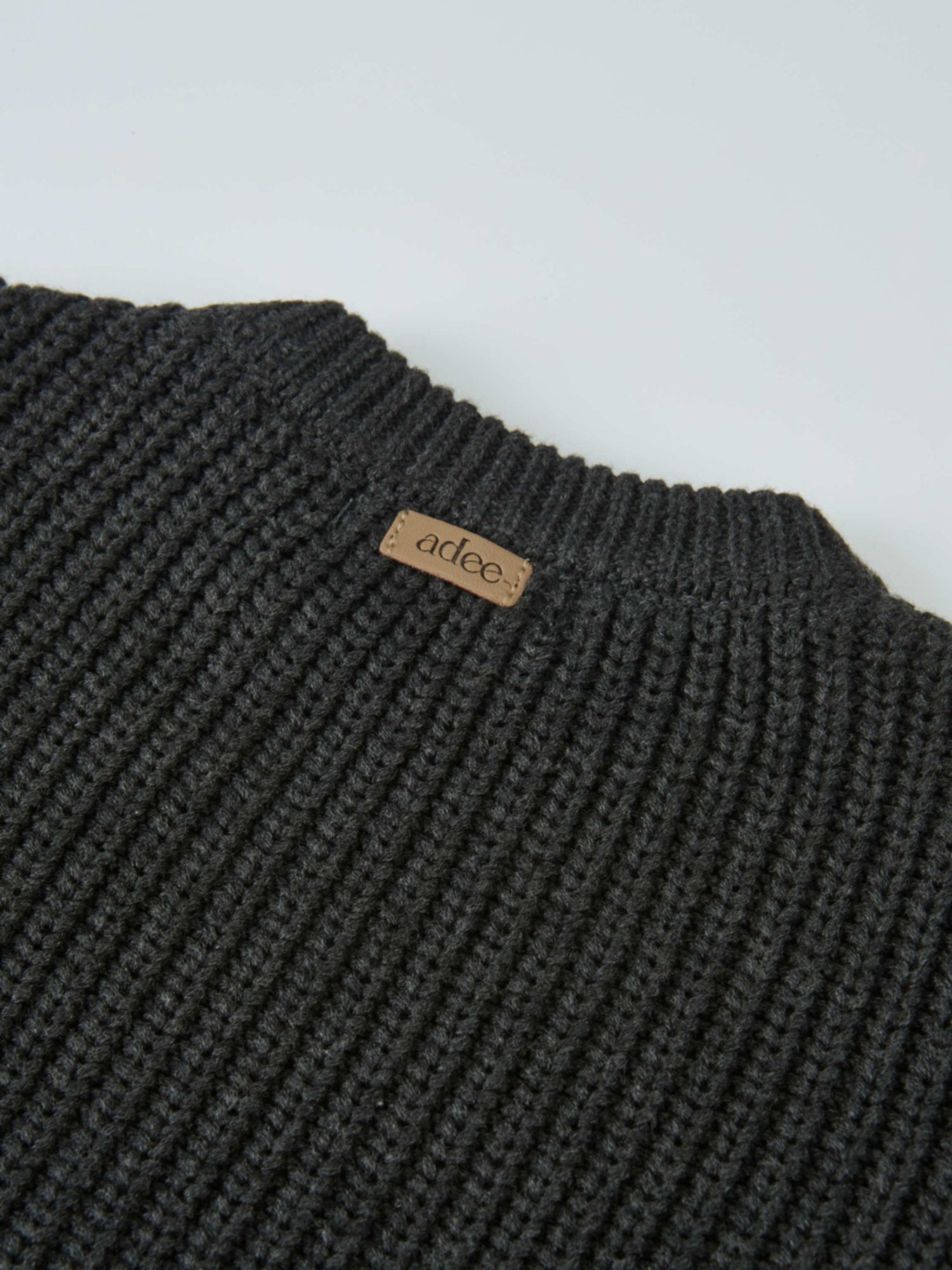 Knit Girl Sweater, grey; Adee brand ribbed knit fabric with tan label.