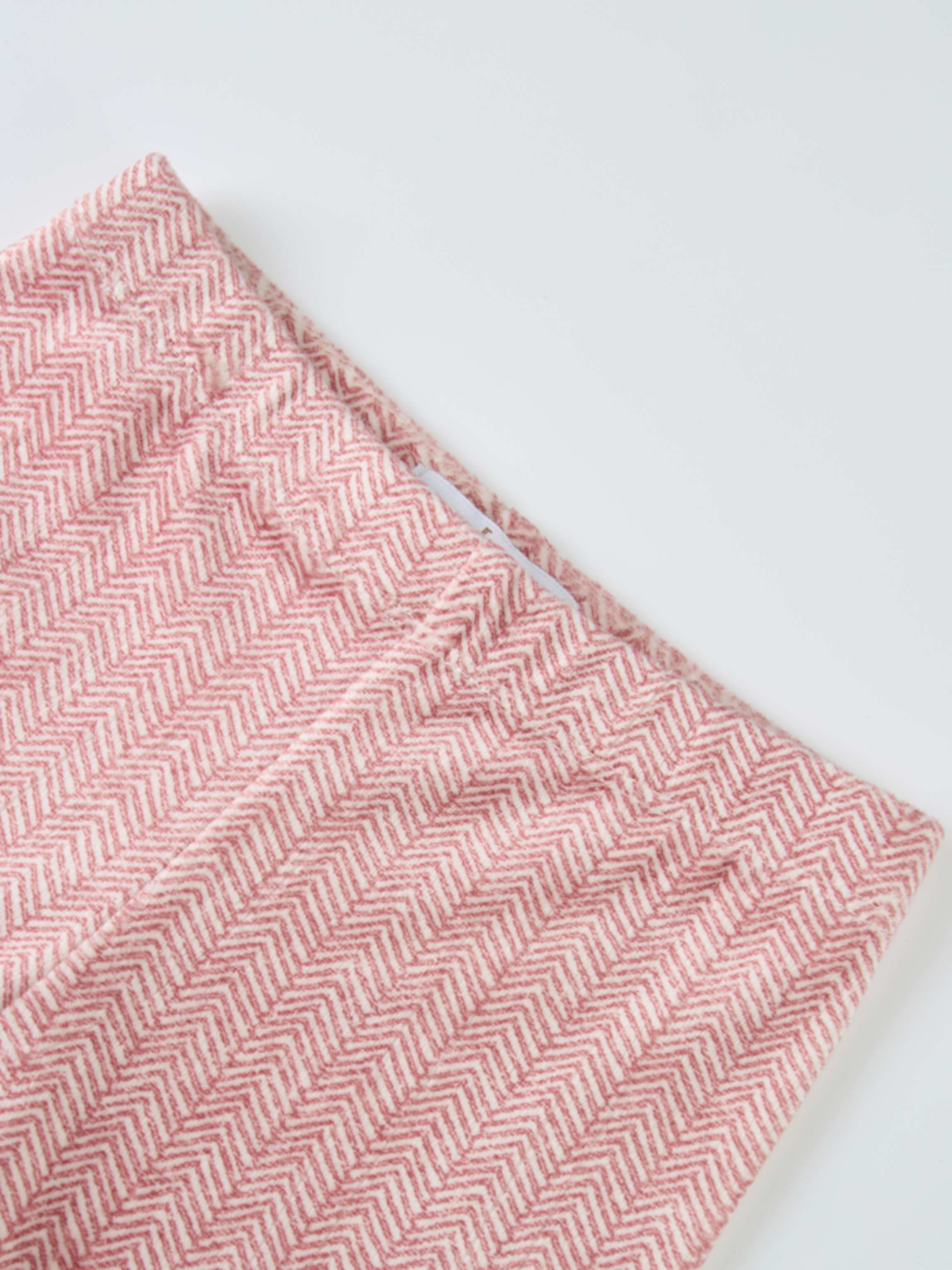 Herringbone Pajamas for girls in red, folded fabric with chevron pattern