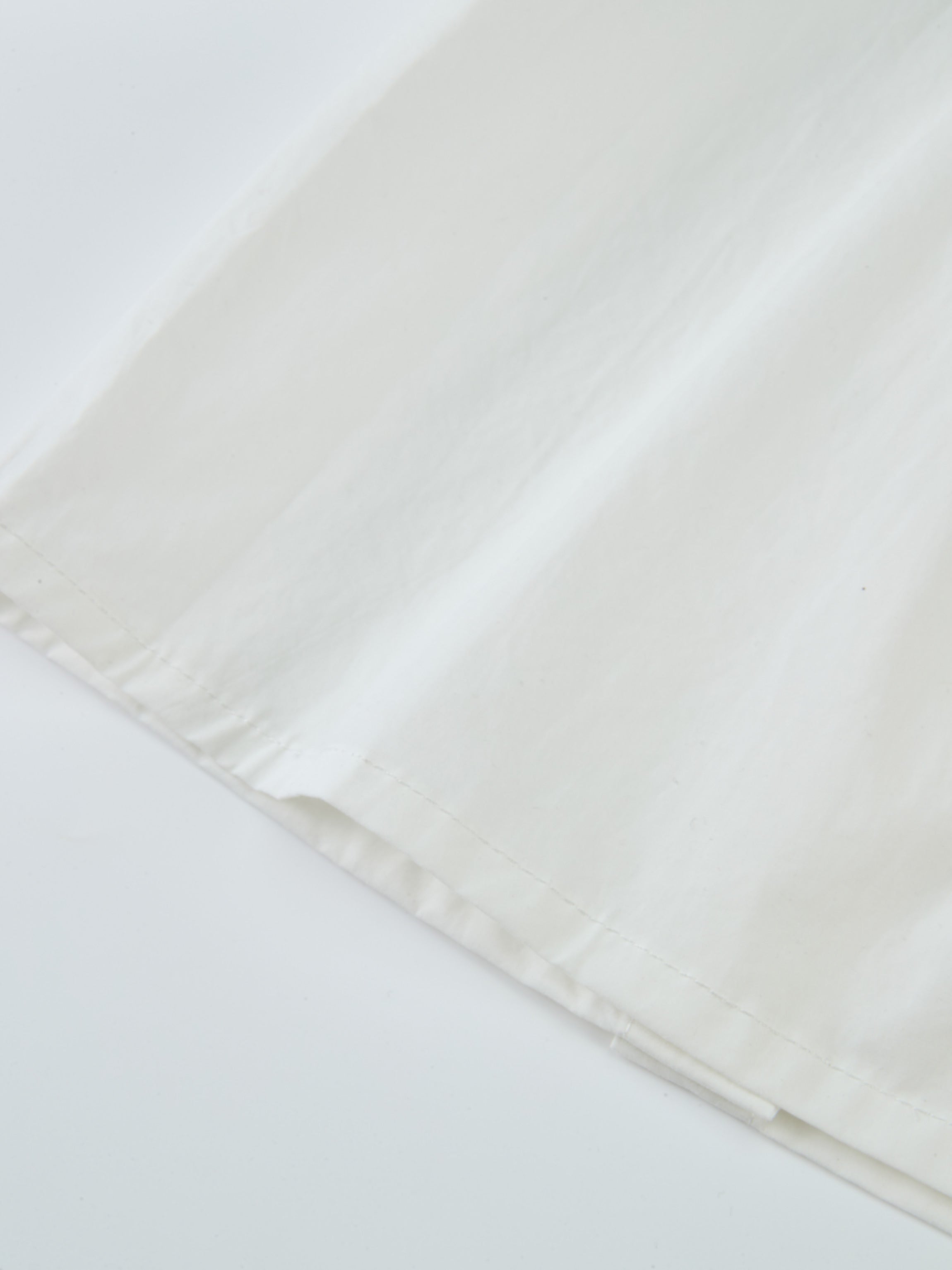 Peter Pan Collar Blouse - White, close-up of fabric and edge hem on a dressy girls&