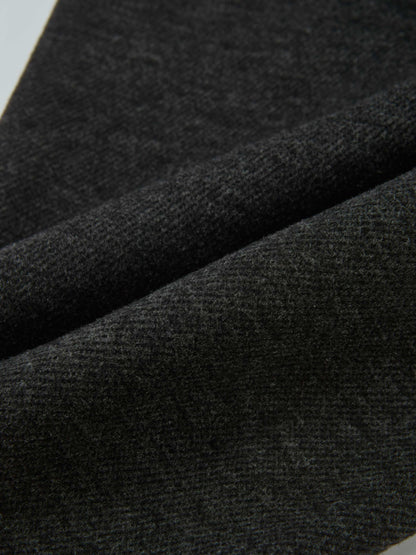 Dress pants for boys in grey; close-up of textured fabric