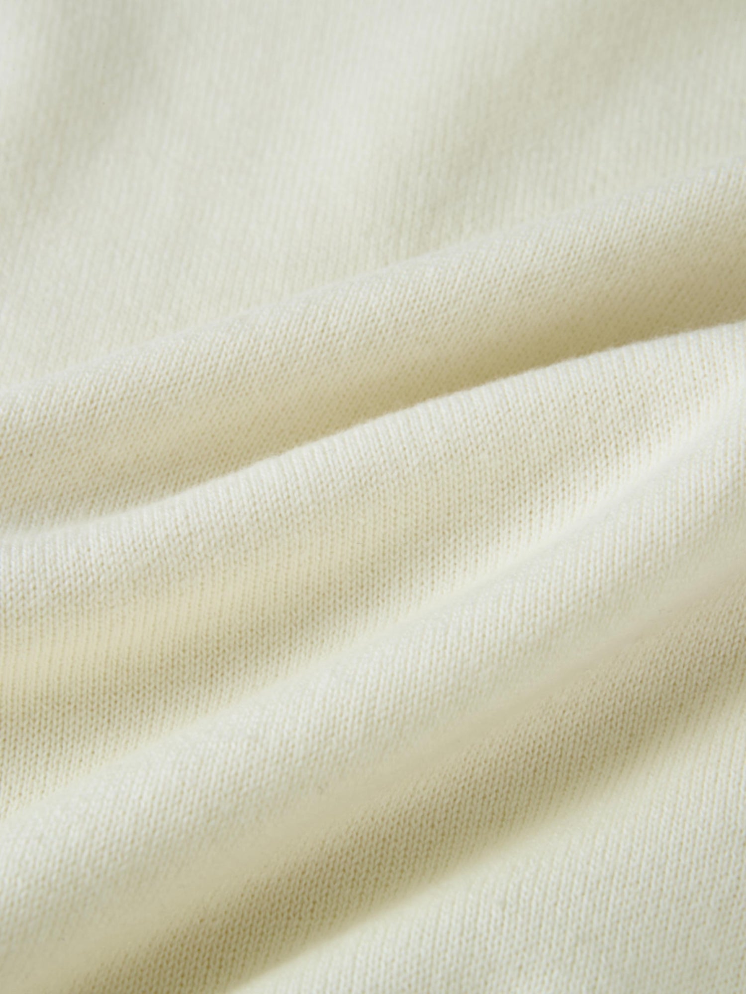 Ruffle Collar Knit Sweater - Cream close-up of soft cream knit fabric