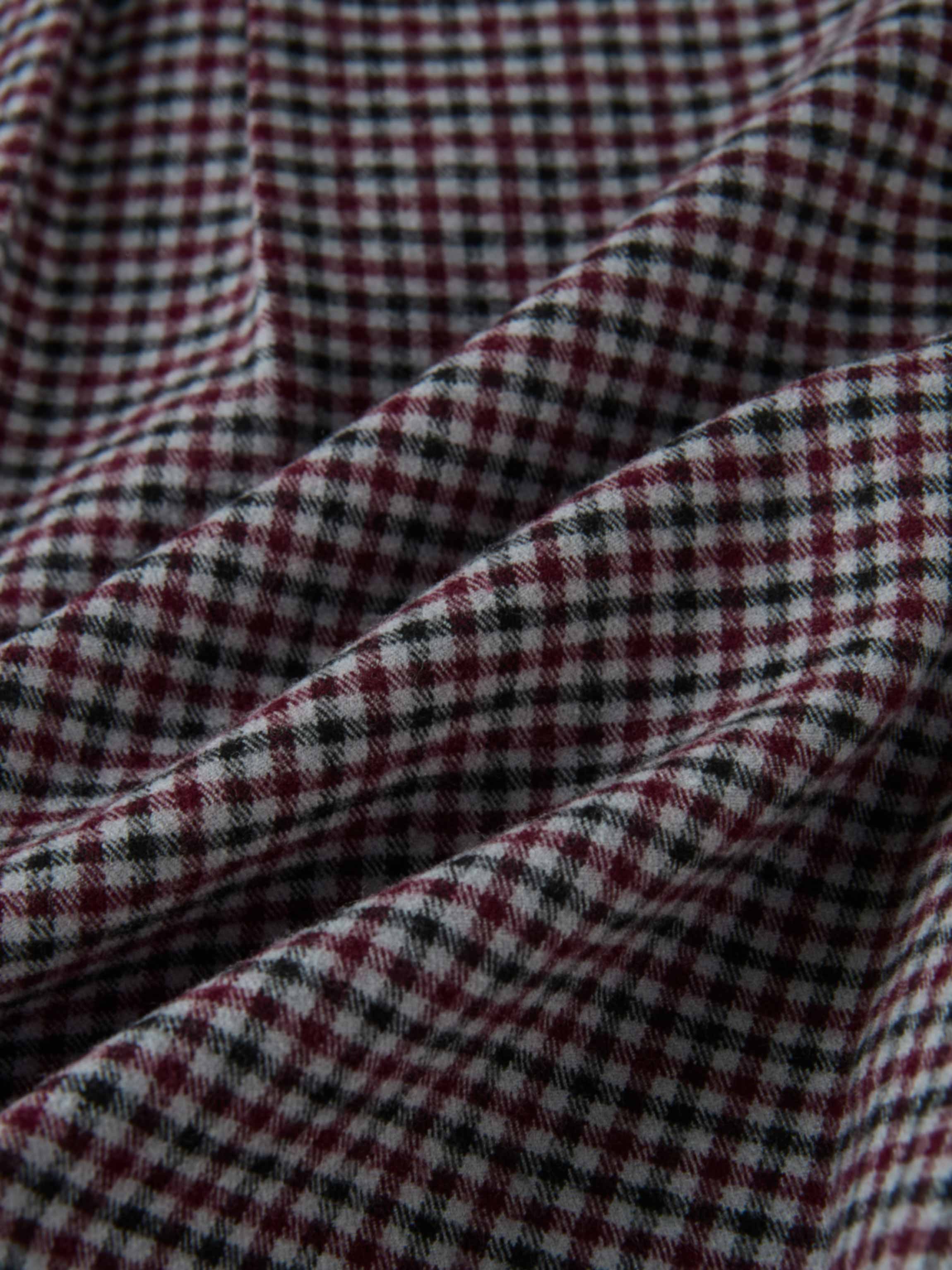 Gingham shirt fabric close-up; burgundy, black and white check pattern