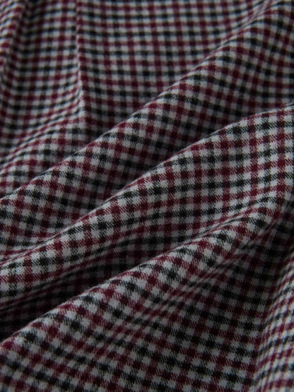 Gingham shirt fabric close-up; burgundy, black and white check pattern