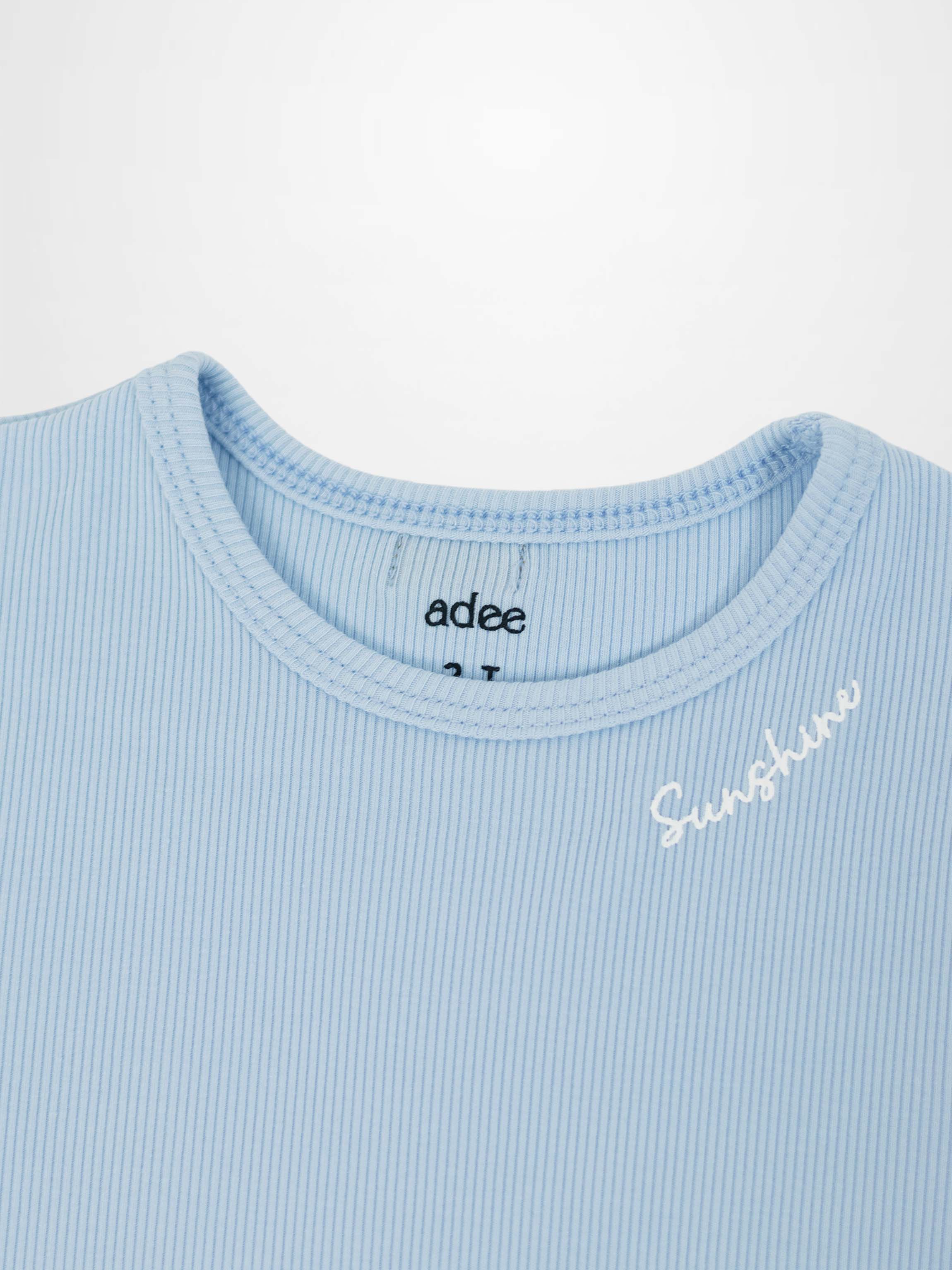 Light blue ribbed T-shirt with 3/4 puff sleeves and Sunshine embroidery on chest.
