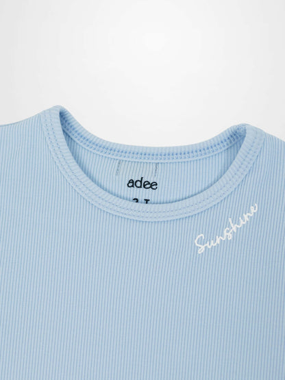 Light blue ribbed T-shirt with 3/4 puff sleeves and Sunshine embroidery on chest.