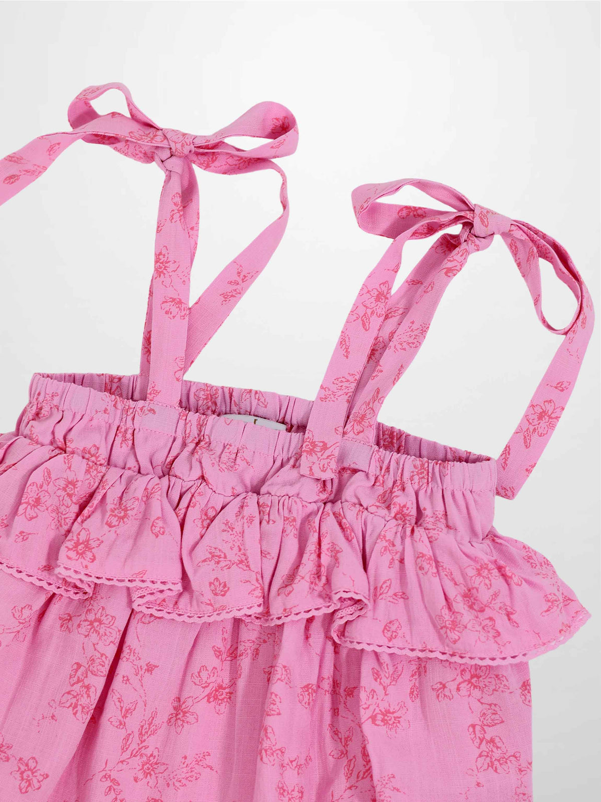 Pink Flower Romper for girls by Adee; dressy floral print with tied shoulder straps.