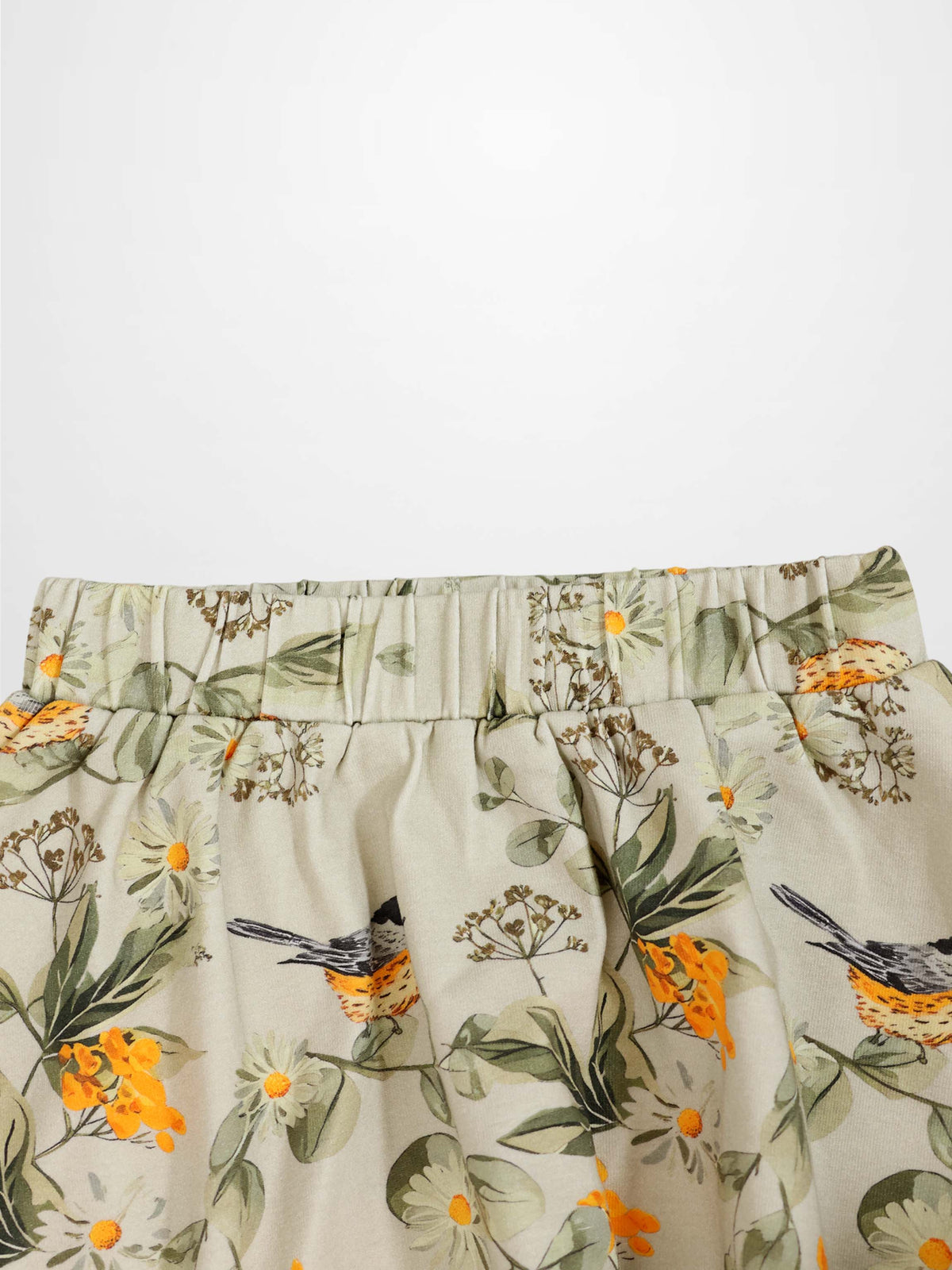 Garden Finch Circle Skirt for girls by Adee, cream floral print with orange accents and elastic waistband.