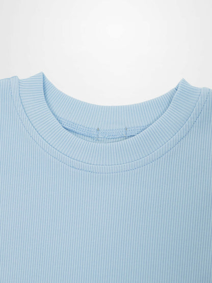 Close-up of light blue thin ribbed T-shirt neckline.