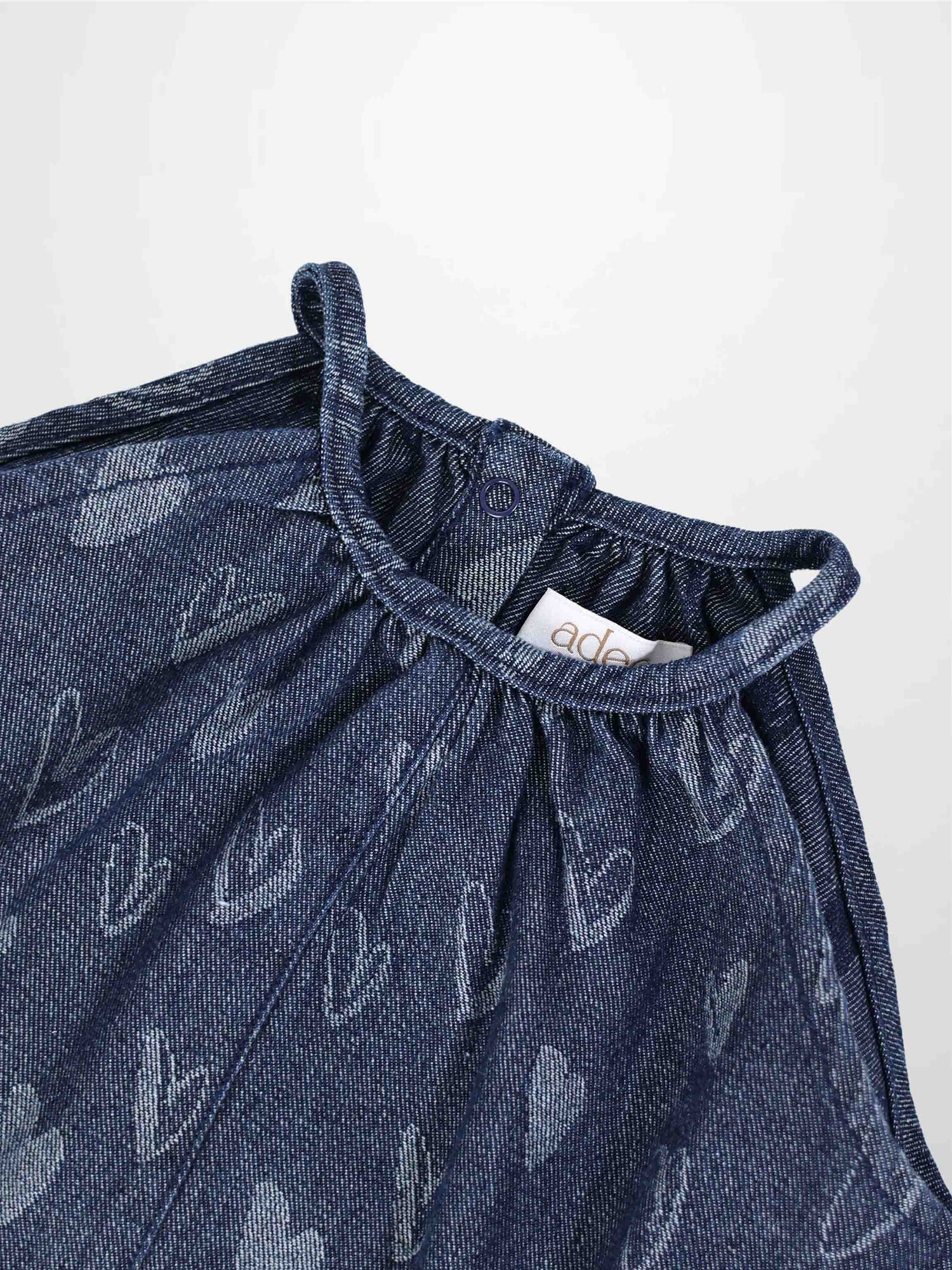 Adee Denim Heart Romper for girls; blue denim with heart print.