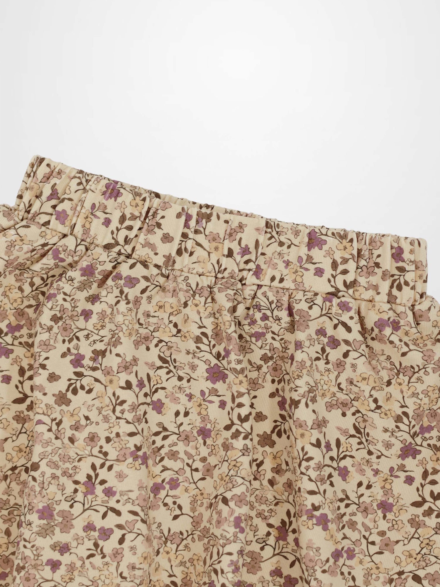 Beige floral-printed skirt with purple flowers and elastic waistband.