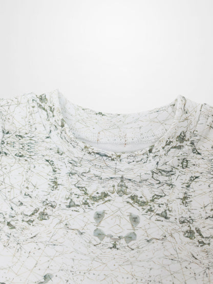 Map T-shirt with sage-green vintage map print on off-white fabric; compass markers and geographic lines.