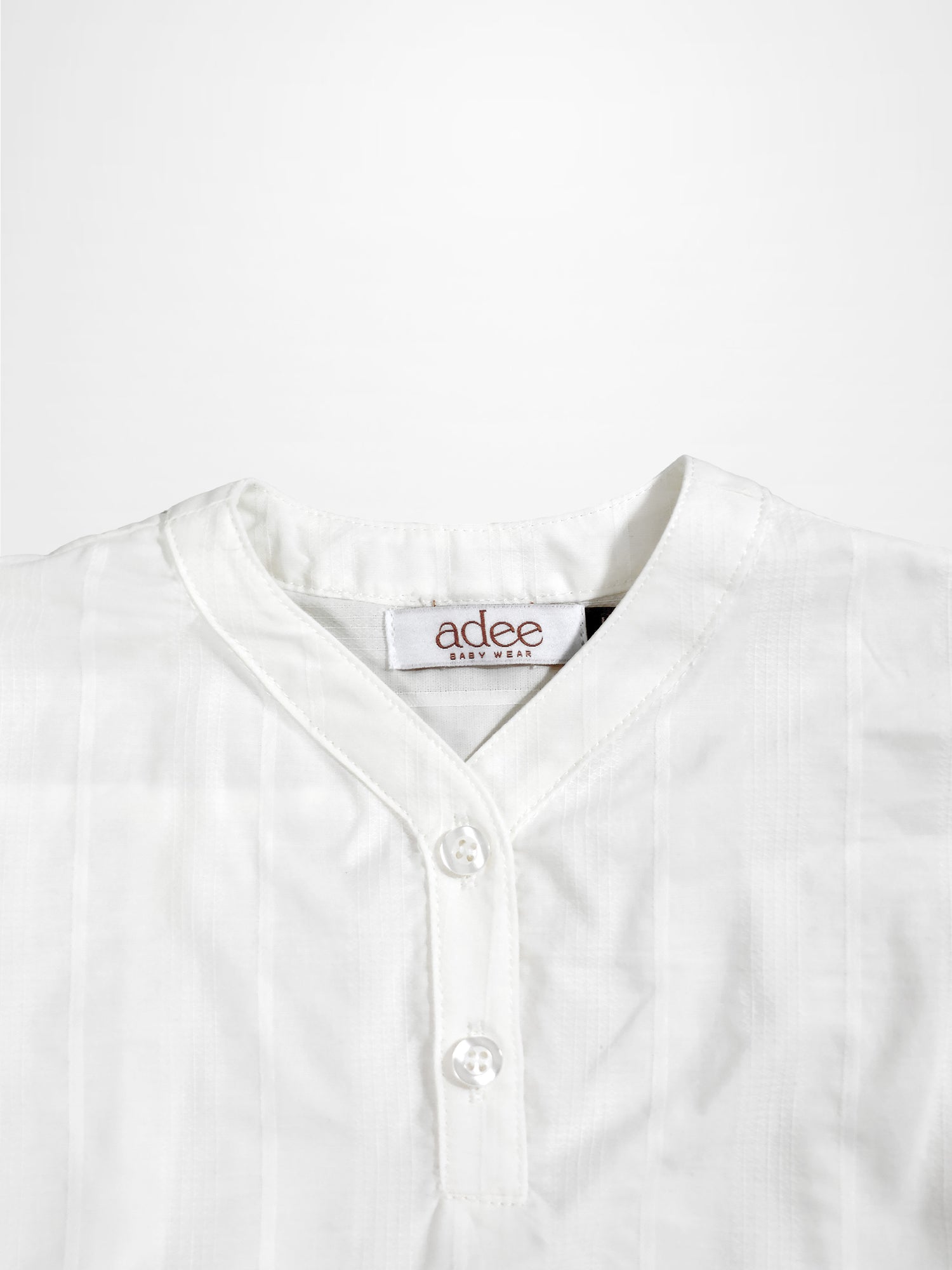 Textured white cotton shirt for boys by Adee; dressy top with button placket.
