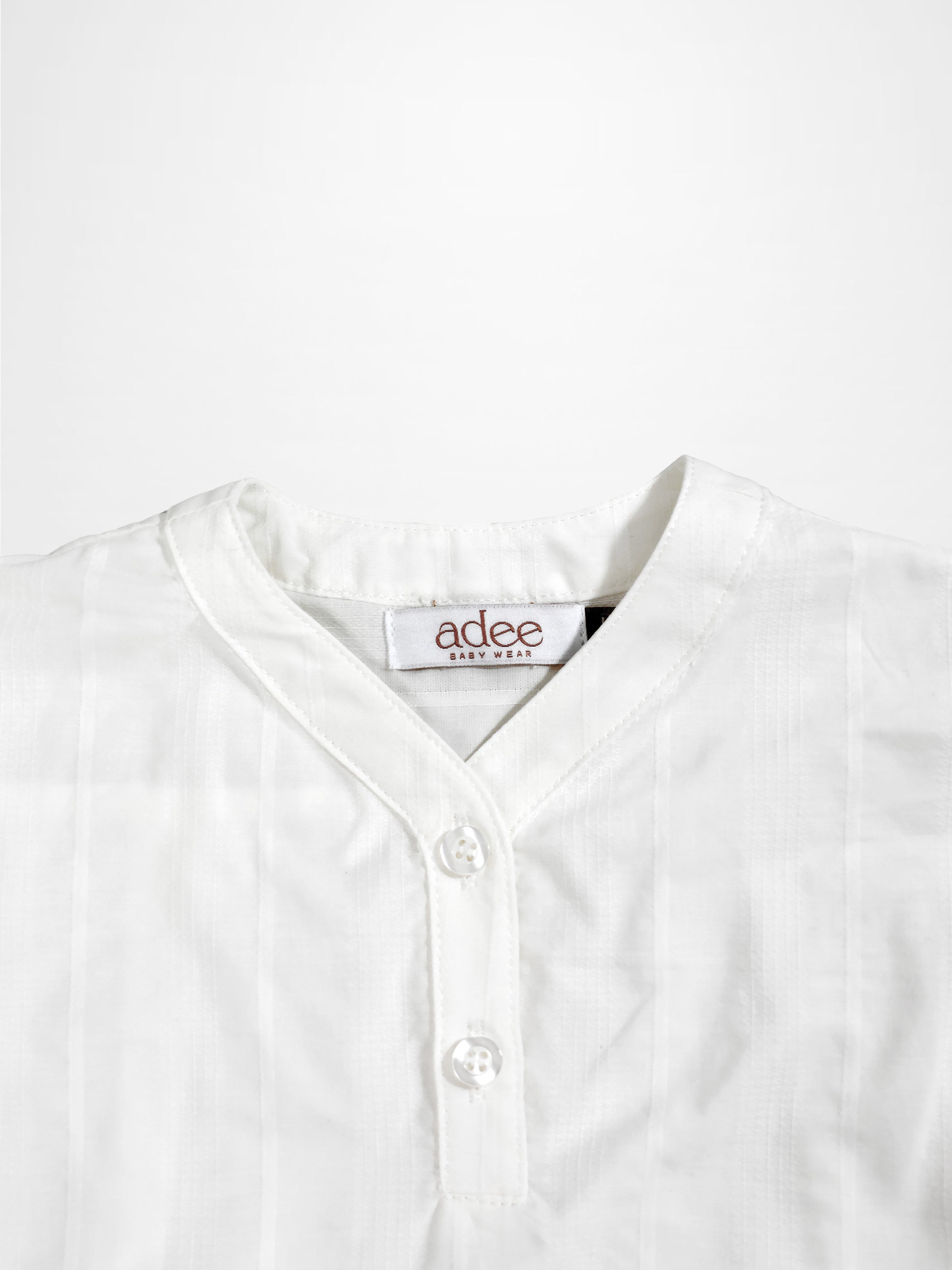 Textured white cotton shirt for boys by Adee; dressy top with button placket.
