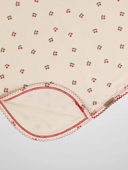 Red Cherry Blanket with Lace receiving blanket by Adee; cream fabric with scattered red cherries and red trim