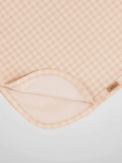 Oatmeal Grid Blanket - Pink by Adee, a girls receiving swaddle blanket with a light pink grid pattern.