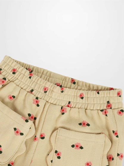 Tan Floral Shorts with pink blossom print and green leaves, elastic waistband and back pocket.
