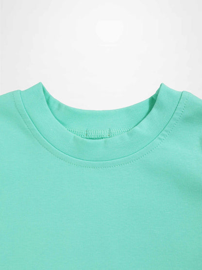 Mint green thin ribbed T-shirt neckline, close-up of fabric and stitching.