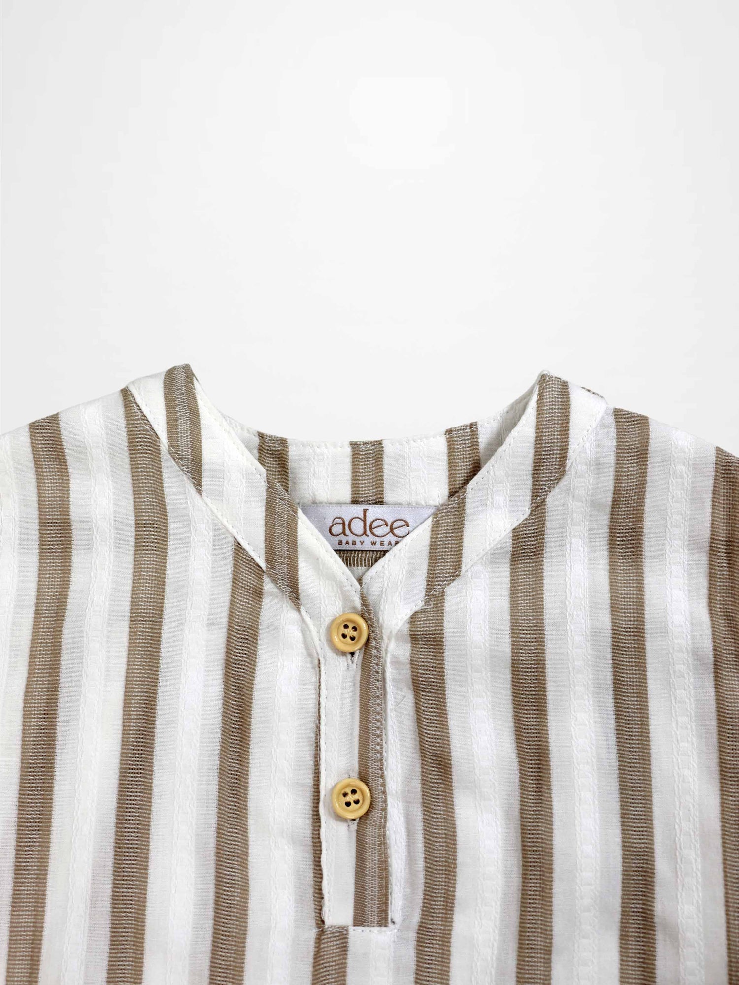 Adee tan and white striped boys dress shirt with a two-button placket.