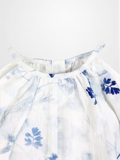 Blue Flower Romper for girls by Adee; dressy white fabric with blue floral print and back neck snap.