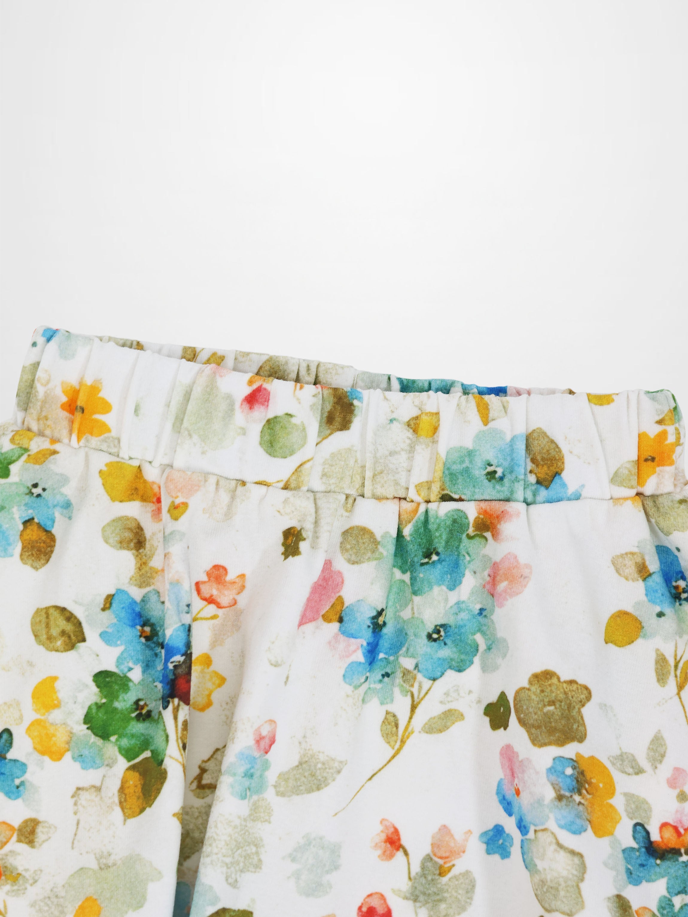 Pastel Flower Skirt for girls, white with watercolor floral print and elastic waistband.